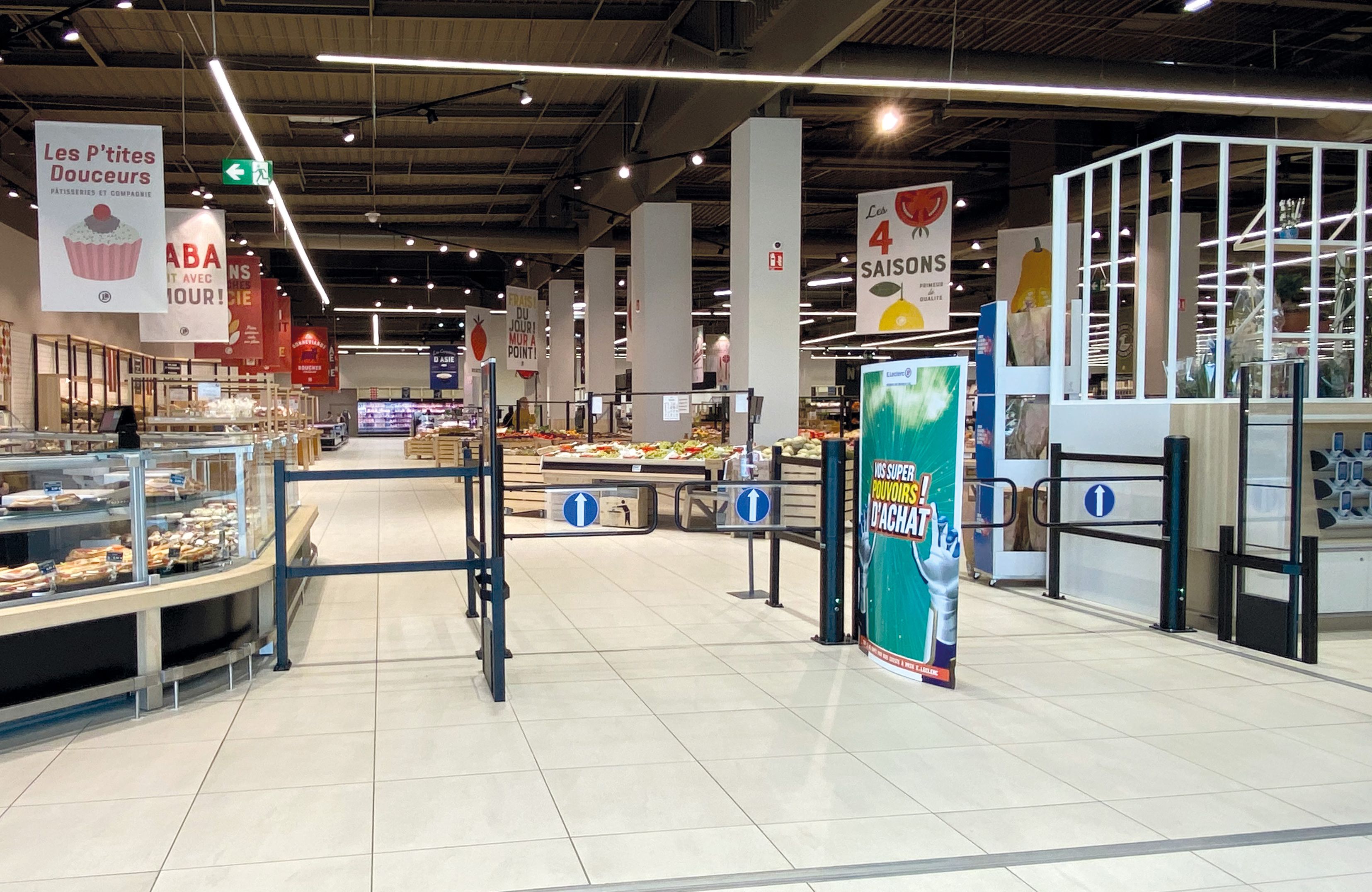 Hypermarket entrance equipped with automatic gates.